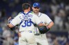 Israel catcher CJ Stubbs (38) and pitcher Tommy Kahnle, right, embrace after defeating Nicaragua in a World Baseball Classic game, Sunday, March 8, 2026, in Miami. (AP Photo/Lynne Sladky)