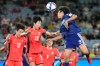 Japan's Riko Ueki, right, heads the ball during the Women's Asian Cup semifinal soccer match between Japan and South Korea in Sydney, Wednesday, March 18, 2026. (AP Photo/Rick Rycroft)