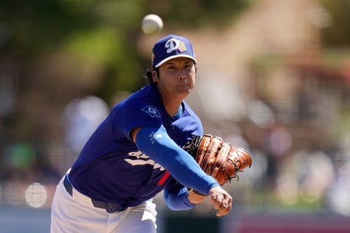 Los Angeles Dodgers starting pitcher Shohei Ohtani, of Japan, throws against the San Francisco Giants during the first inning of a spring training baseball game, Wednesday, March 18, 2026, in Phoenix. (AP Photo/Ross D. Franklin)