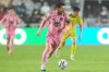 Inter Miami forward Lionel Messi (10) runs with the ball during the first half of a CONCACAF Champions Cup Round of 16 soccer match against Nashville, Wednesday, March 18, 2026, in Fort Lauderdale, Fla. (AP Photo/Marta Lavandier)