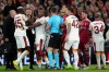 Galatasaray's Victor Osimhen, second left argues with Liverpool's Virgil van Dijk during the second leg of the Champions League round of 16 soccer match between Liverpool and Galatasaray, in Liverpool, England, Wednesday, March 18, 2026. (AP Photo/Jon Super)