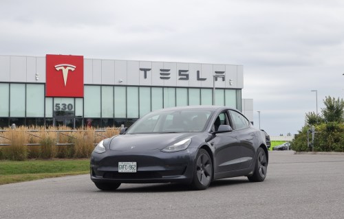 A Tesla electric vehicle is seen leaving a Tesla showroom and service centre in Ottawa on Friday, Aug. 30, 2024. THE CANADIAN PRESS/ Patrick Doyle