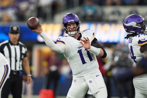 FILE - Minnesota Vikings quarterback Carson Wentz throws a pass during the first half of an NFL football game against the Los Angeles Chargers, Oct. 23, 2025, in Inglewood, Calif. (AP Photo/Gregory Bull, File)