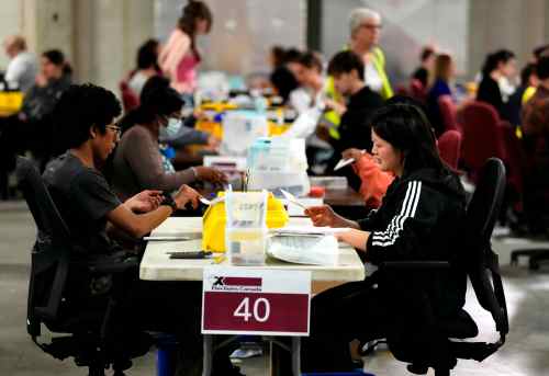 Election workers count special ballots, ballots cast by Canadians outside their ridings, at the Elections Canada Distribution Centre on the day of the federal election, in Ottawa, on Monday, April 28, 2025. THE CANADIAN PRESS/Justin Tang