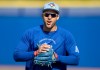 Toronto Blue Jays slugger George Springer calls to teammates as he heads to the outfield at spring training in Dunedin, Fla., on Feb. 17, 2026. THE CANADIAN PRESS/Frank Gunn