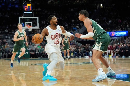 Cleveland Cavaliers' Donovan Mitchell (45) drives to the basket against Milwaukee Bucks' Ousmane Dieng during the first half of an NBA basketball game, Tuesday, March 17, 2026, in Milwaukee. (AP Photo/Aaron Gash)