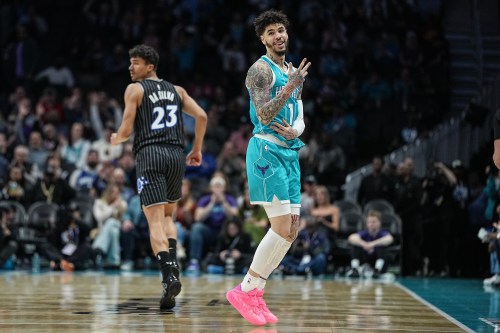 Charlotte Hornets guard LaMelo Ball (1) gestures after making a 3-point basket during the first half of an NBA basketball game against the Orlando Magic, Thursday, March 19, 2026, in Charlotte, N.C. (AP Photo/Matt Kelley)