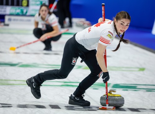 Team Canada lead Karlee Burgess sweeps against Norway at the World Women's Curling Championship in Calgary, Thursday, March 19, 2026. THE CANADIAN PRESS/Jeff McIntosh