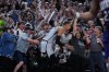 San Antonio Spurs forward Victor Wembanyama (1) is celebrated by fans after he hit a game-winning score against the Phoenix Suns in the final seconds of an NBA basketball game in San Antonio, Thursday, March 19, 2026. (AP Photo/Eric Gay)
