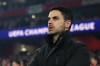 Arsenal's manager Mikel Arteta looks on during the warm up prior to the second leg of the Champions League round of 16 soccer match between Arsenal and Bayer Leverkusen, in London, Tuesday, March 17, 2026. (AP Photo/Ian Walton)