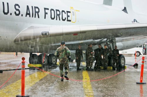 File photo — U.S. air force members stand under the wing of an E-3 Sentry-AWACS aircraft at Tinker Air Force base near Oklahoma City, Friday, June 29, 2007. (AP Photo)