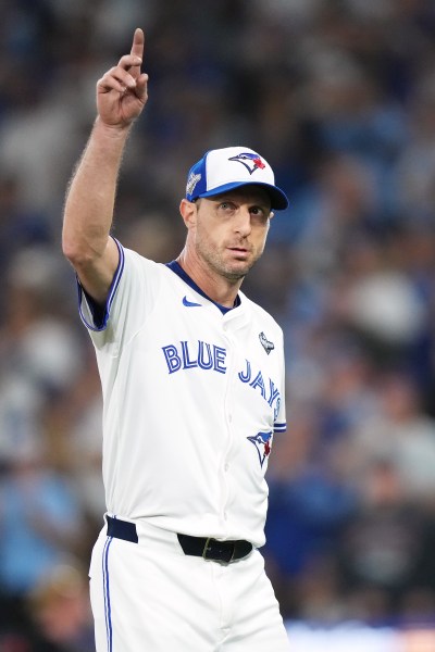 Blue Jays pitcher Max Scherzer (31) waves to the crowd as he leaves the game after being pulled during the fifth inning of Game 7 of the World Series against the Los Angeles Dodgers in Toronto on Nov. 1, 2025. THE CANADIAN PRESS/Nathan Denette
