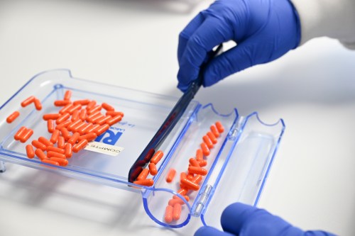 A technician counts pills in a pharmacy laboratory, Wednesday February 5, 2025. THE CANADIAN PRESS/Jacques Boissinot