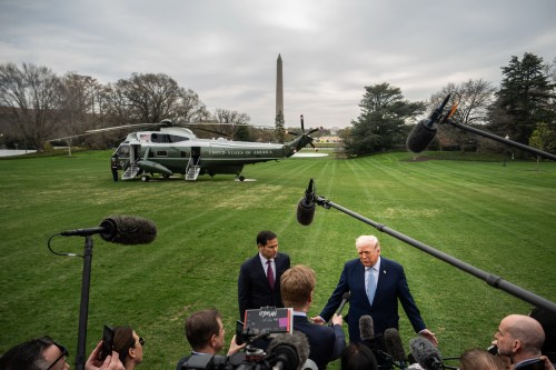 President Donald Trump, accompanied by Secretary of State Marco Rubio, speaks with reporters while departing the White House, Friday, March 20, 2026, in Washington. (AP Photo/Julia Demaree Nikhinson)