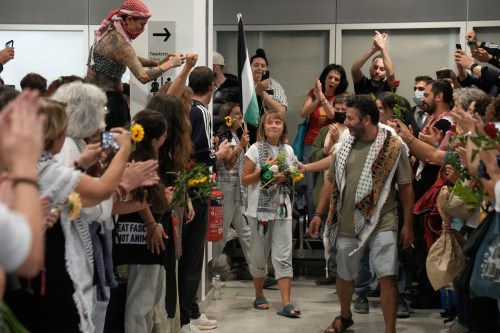 Swedish activist Greta Thunberg, centre, arrives at the Eleftherios Venizelos International Airport in Athens, Monday, Oct. 6, 2025 after being deported from Israel for taking part in a Gaza-bound aid flottila. THE CANADIAN PRESS/AP-Petros Giannakouris