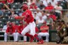 Los Angeles Angels' Chris Taylor (33) and San Diego Padres catcher Freddy Fermin, right, watches the flight of Taylor's triple during the second inning of a spring training baseball game Tuesday, March 10, 2026, in Tempe, Ariz. (AP Photo/Ross D. Franklin)