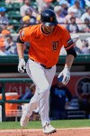 Detroit Tigers' Austin Slater runs after hitting a double in the second inning of a spring training baseball game, Monday, March 9, 2026, in Lakeland, Fla. (AP Photo/John Raoux)
