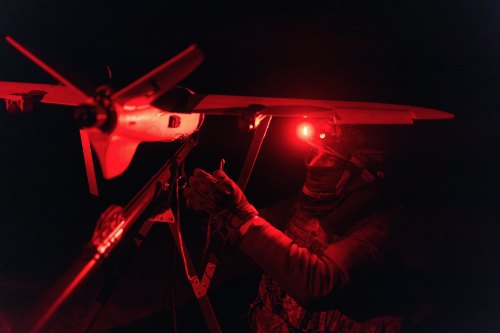 A soldier of the 127th Separate Territorial Brigade launches a drone to search for Russian attack drones at the front line in the Kharkiv region Saturday, March 14, 2026. (AP Photo/Nikoletta Stoyanova)
