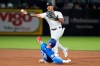 New York Yankees second baseman Jorbit Vivas forces Toronto Blue Jays' Nathan Lukes at second base and relays the throw to first in time to turn a double play against Eloy Jiménez during the sixth inning of a spring training baseball game Wednesday, March 11, 2026, in Tampa, Fla. (AP Photo/Chris O'Meara)
