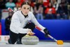 Switzerland's skip Xenia Schwaller delivers a stone against Team Canada during the gold medal draw at the World Women’s Curling Championship in Calgary, Sunday, March 22, 2026.  THE CANADIAN PRESS/Jeff McIntosh