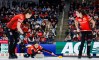 Team Canada skip Kerri Einarson, centre, delivers a stone against Switzerland as lead Karlee Burgess, left, and second Shannon Birchard sweep during the gold medal draw at the World Women’s Curling Championship in Calgary, Sunday, March 22, 2026. THE CANADIAN PRESS/Jeff McIntosh