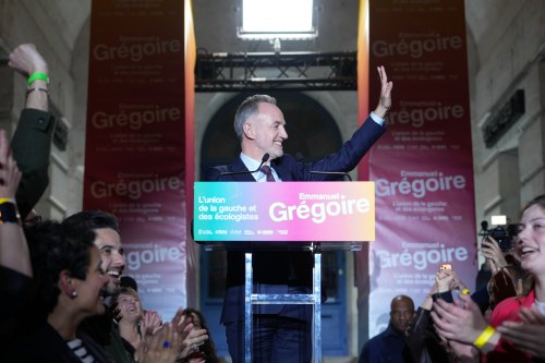 French socialist candidate for Paris mayoral election, Emmanuel Gregoire, center, celebrates after he won the second round of France's municipal elections in Paris, France, Sunday, March 22, 2026. (AP Photo/Thibault Camus)