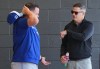 Toronto Blue Jays manager John Schneider, left, talks with Blue Jays general manager Ross Atkins, right, as players work out during spring training in Dunedin Fla., on Friday, Feb. 14, 2025. THE CANADIAN PRESS/Nathan Denette