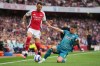 FILE - Arsenal's Ben White, left, duels for the ball with Bournemouth's Milos Kerkez during the English Premier League soccer match between Arsenal and Bournemouth in London, on May 3, 2025. (AP Photo/Kin Cheung, File)