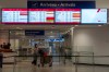 Flights from New York LaGuardia Airport are listed as cancelled at Montreal-Pierre Elliott Trudeau International Airport in Montreal on Monday, March 23, 2026. THE CANADIAN PRESS/Christinne Muschi