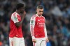 Arsenal's Bukayo Saka, left speaks to Arsenal's Leandro Trossard after the end of the English League Cup final soccer match between Arsenal and Manchester City in London, Sunday, March 22, 2026. (AP Photo/Maja Smiejkowska)
