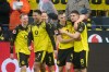 Dortmund's scorer Luca Reggiani, right, and his teammates celebrate thier side's second goal during the German Bundesliga soccer match between Borussia Dortmund and FC Augsburg in Dortmund, Germany, Saturday, March 14, 2026. (Bernd Thissen/dpa via AP)