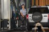 A worker fuels a car at a YPF gas station in Buenos Aires, Argentina, Friday, March 20, 2026. (AP Photo/Rodrigo Abd)