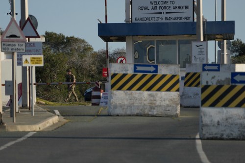 A British soldier guards at the main gate of the U.K.'s RAF Akrotiri, near Limassol, Cyprus, Thursday, March 5, 2026. (AP Photo/Petros Karadjias)