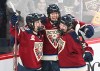 Montreal Victoire's Laura Stacey (7) celebrates with teammates Marie-Philip Poulin (29) and Maggie Flaherty (91) after scoring against the Minnesota Frost's during third period PWHL hockey action in Laval, Que., Sunday, March 1, 2026. THE CANADIAN PRESS/Graham Hughes