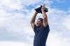 First-place individual champion, captain Bryson DeChambeau, of Crushers GC, poses for a photo with the trophy after the final round of LIV Golf South Africa at The Club at Steyn City, Sunday, March 22, 2026, in Midrand, South Africa. (LIV Golf via AP)