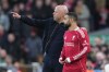 Liverpool's manager Arne Slot talks to Mohamed Salah during the Premier League soccer match between Liverpool and Tottenham in Liverpool, England, Sunday, March 15, 2026. (AP Photo/Jon Super)