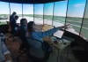 Instructor Karina Vasylenko, front, shows media how the air traffic control simulator works at the CAE training facility in Montreal, Tuesday, Jan. 14, 2025. THE CANADIAN PRESS/Ryan Remiorz