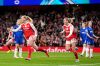Arsenal's Stina Blackstenius, left, celebrates scoring their side's first goal of the game during the Women's Champions League soccer match between Arsenal and Chelsea in London, Tuesday, March 24, 2026. (John Walton/PA via AP)