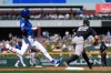 New York Yankees first baseman Ben Rice (22) makes a catch at first base to get Chicago Cubs' Pete Crow-Armstrong out during the third inning of a spring training baseball game, Tuesday, March 24, 2026, in Mesa, Ariz. (AP Photo/Ross D. Franklin)