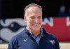 Toronto Blue Jays President Mark Shapiro smiles as he watches live batting practice at Spring Training in Dunedin, Fla., on Thursday, Feb. 19, 2026. THE CANADIAN PRESS/Frank Gunn