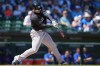 New York Yankees' Randal Grichuk connects for a home run against the Chicago Cubs during the fourth inning of a spring training baseball game, Tuesday, March 24, 2026, in Mesa, Ariz. (AP Photo/Ross D. Franklin)