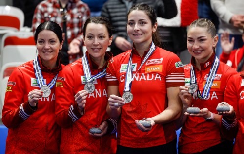 Canada skip Kerri Einarson, left to right, third Val Sweeting, second Shannon Birchard and lead Karlee Burgess hold their silver medals after losing the gold medal game to Switzerland at the World Women’s Curling Championship in Calgary, Sunday, March 22, 2026. THE CANADIAN PRESS/Jeff McIntosh