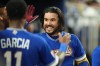 Venezuela designated hitter Eugenio Suárez celebrates after hitting a home run during the fourth inning of a World Baseball Classic semifinal game against Italy, Monday, March 16, 2026, in Miami. (AP Photo/Rebecca Blackwell)