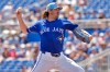 Toronto Blue Jays pitcher Kevin Gausman (34) pitches to Canada during the first inning of an exhibition baseball game Tuesday, March 3, 2026, in Dunedin, Fla. (AP Photo/Chris O'Meara)