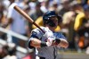 Detroit Tigers' Kevin McGonigle watches his RBI double during the first inning of an opening-day baseball game against the San Diego Padres, Thursday, March 26, 2026, in San Diego. (AP Photo/Denis Poroy) CORRECTS SPELLING OF McGonigle from McGonigal.