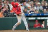 Los Angeles Angels' Mike Trout hits a home run against the Houston Astros during the seventh inning of an opening-day baseball game Thursday, March 26, 2026, in Houston. (AP Photo/David J. Phillip)