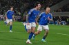 Italy's Federico Dimarco, right, celebrates with teammate Sandro Tonali who scored his side's first goal during the World Cup qualifying play-off soccer match between Italy and Northern Ireland, in Bergamo, Italy, Thursday, March 26, 2026. (AP Photo/Antonio Calanni)