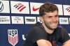 Unites States' Christian Pulisic listens during a news conference before the men's national soccer team training, Friday, March 27, 2026, in Marietta, Ga. (AP Photo/Ronald Blum