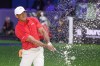 Tiger Woods of the Jupiter Links Golf Club plays a shot from a bunker on the eighth hole, during final day of TGL golf tournament, Tuesday, March 24, 2026, in Palm Beach Gardens Fla. (AP Photo/Reinhold Matay)