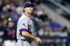 FILE - Texas Rangers pitcher Jacob deGrom reacts during the fifth inning of a baseball game against the New York Mets, Friday, Sept. 12, 2025, in New York. (AP Photo/Adam Hunger, File)